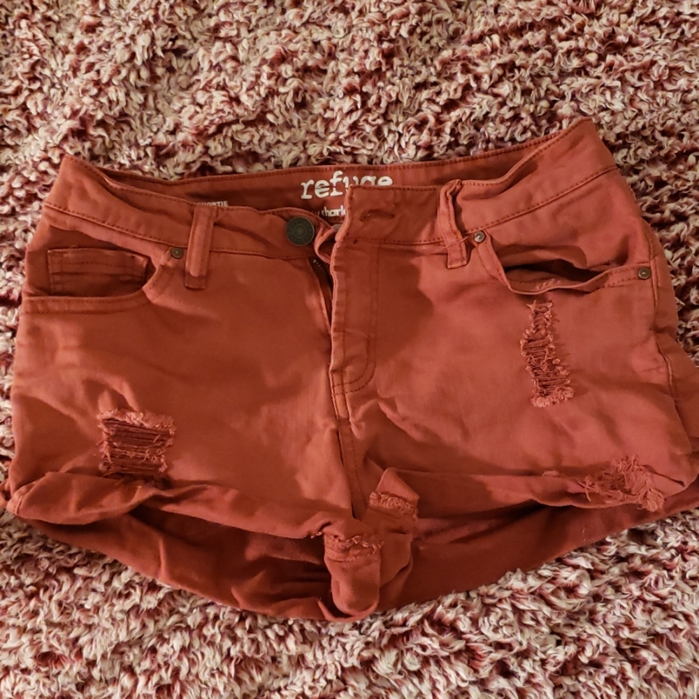 orange distressed shorts